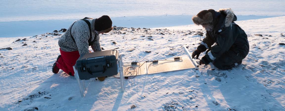 Two researchers in the arctic